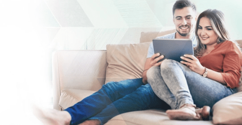 Man Talking on Phone with Laptop